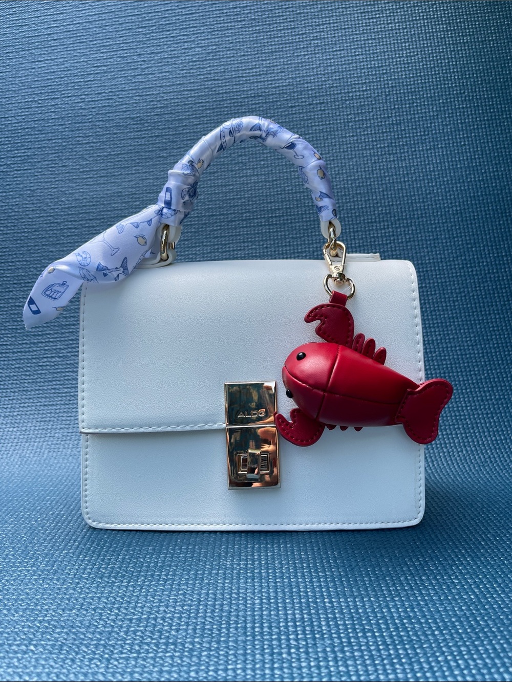 Aldo White Handbag with Red Lobster Charm